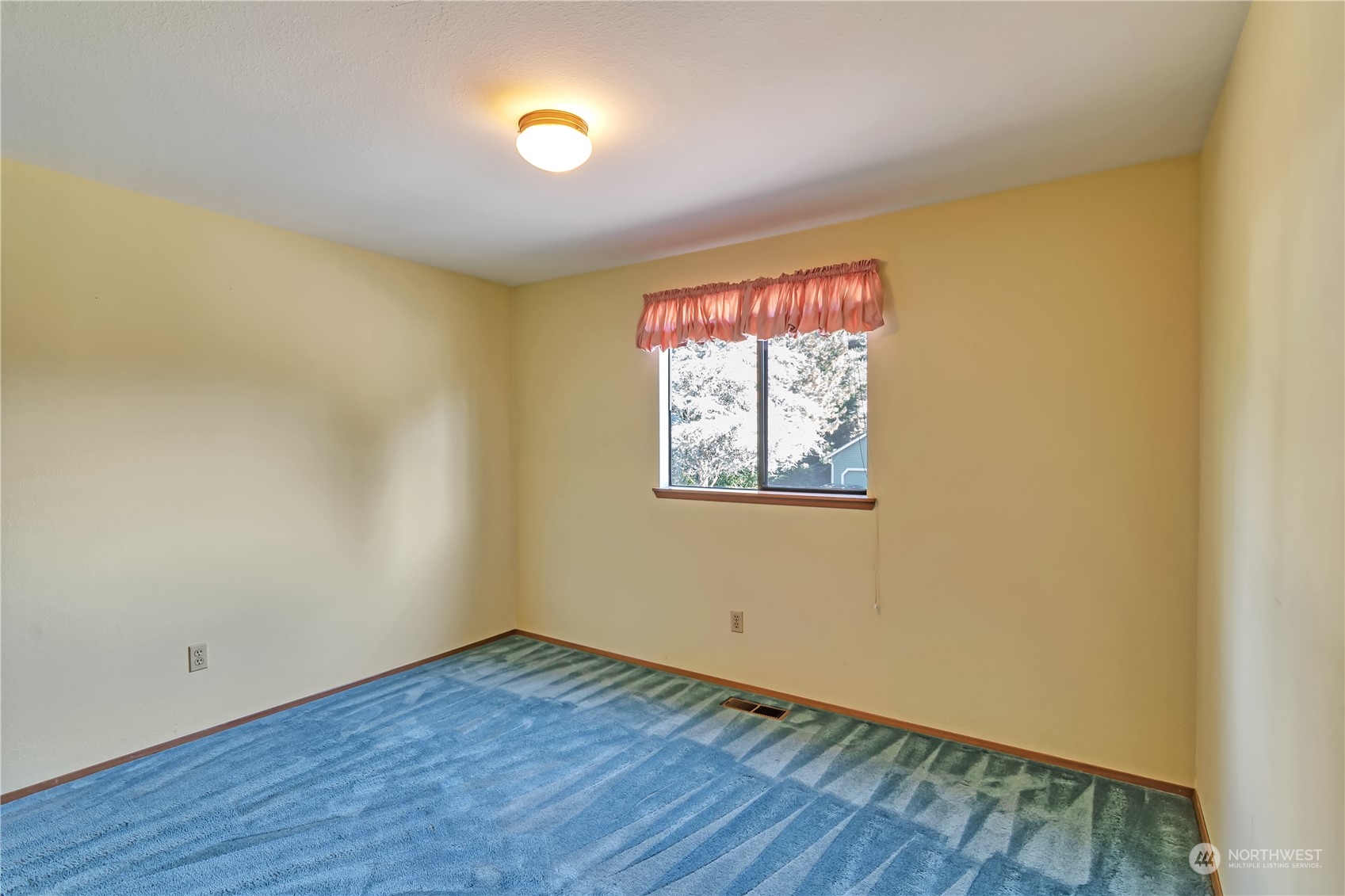 18330 26th Drive Southeast Bothell, WA 98012 - Photo 17 of 24 a view of an empty room with wooden floor and a window