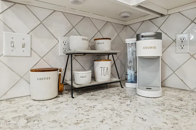 a utility room with a wooden floor and cabinets