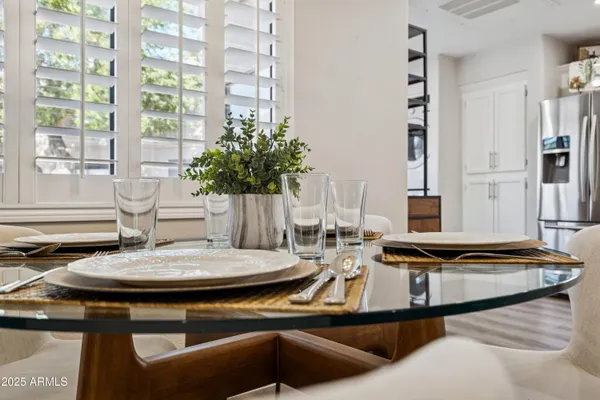 a kitchen with a table chairs and a stove