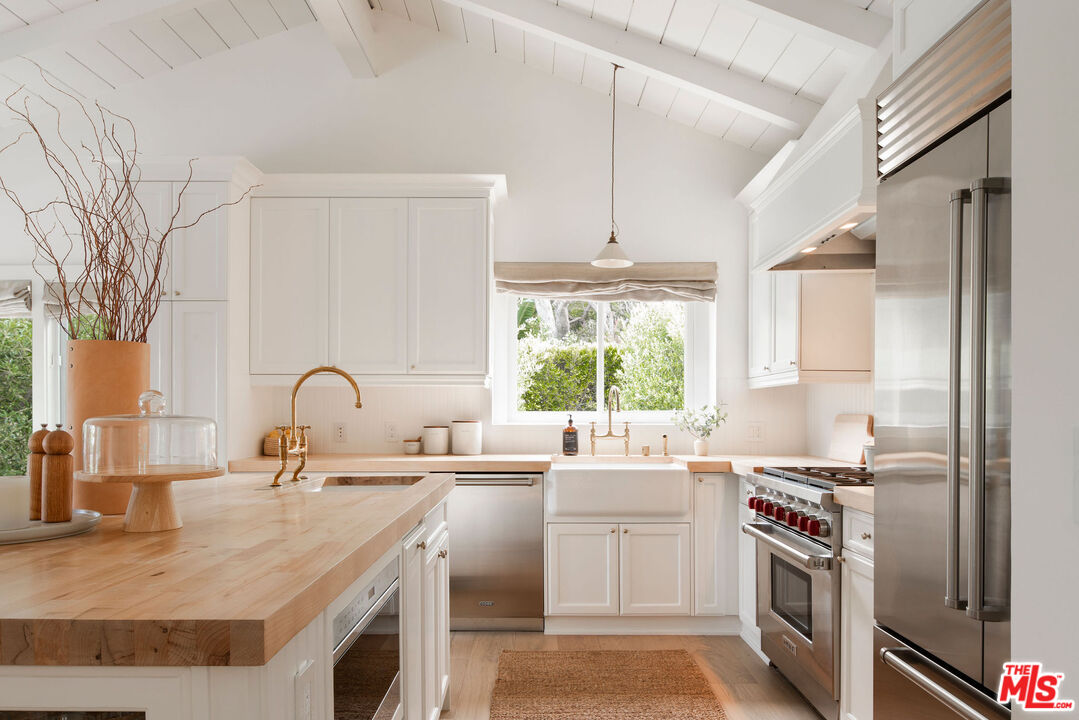 6456 Sycamore Meadows Drive Malibu, CA 90265 - Photo 1 of 29 a kitchen with a sink stove and refrigerator