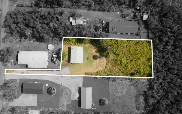 an aerial view of a residential houses with outdoor space