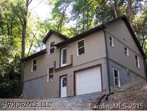 0 Three Three Mile Knob Road Pisgah Forest, NC 28768 - Photo 1 of 6 a front view of a house with a tree