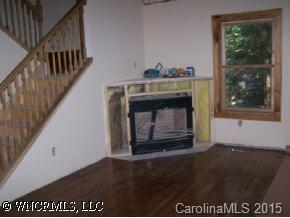 0 Three Three Mile Knob Road Pisgah Forest, NC 28768 - Photo 2 of 6 a view of an empty room with wooden floor and a window
