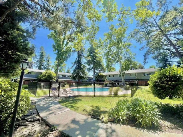 a view of a swimming pool with a patio