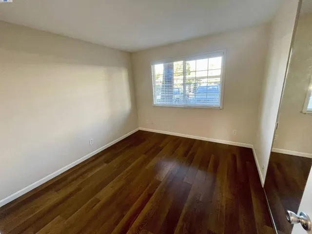 a view of wooden floor in an empty room