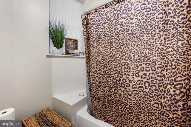 a bathroom with a shower curtain