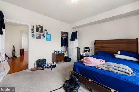 a bedroom with furniture and a chair