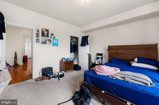 a bedroom with furniture and a chair