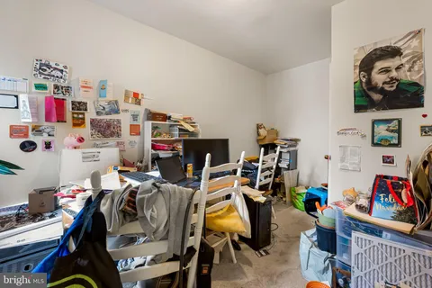 a view of a workspace with furniture and toys
