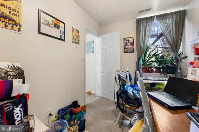 a view of a workspace with furniture and toys