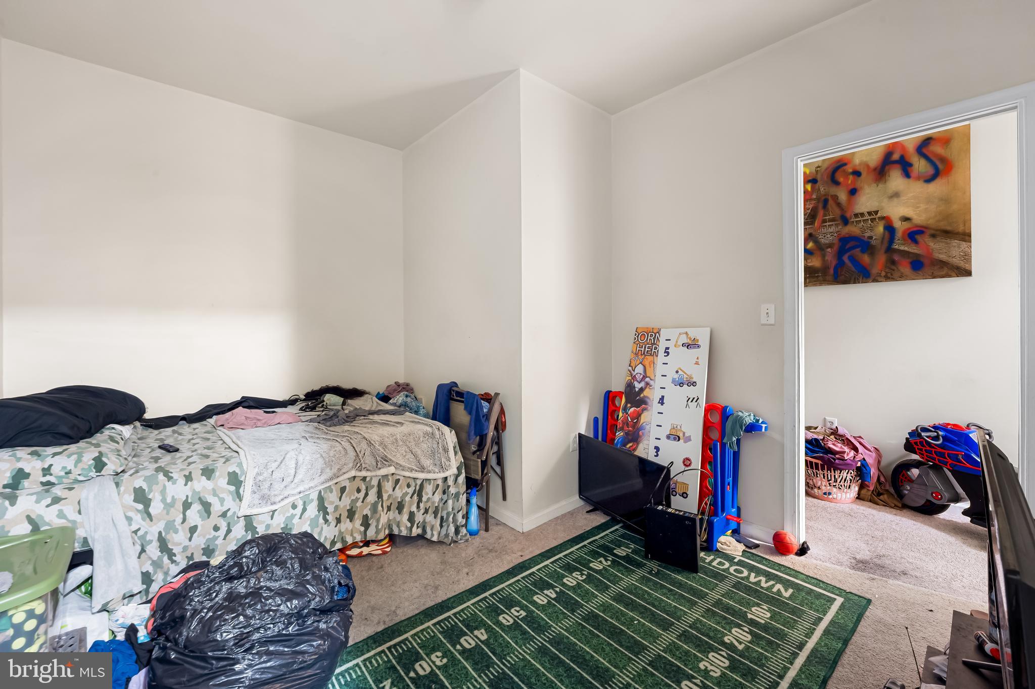 906 Whitelock Street Baltimore, MD 21217 - Photo 8 of 36 a bed room with a bed and a couch