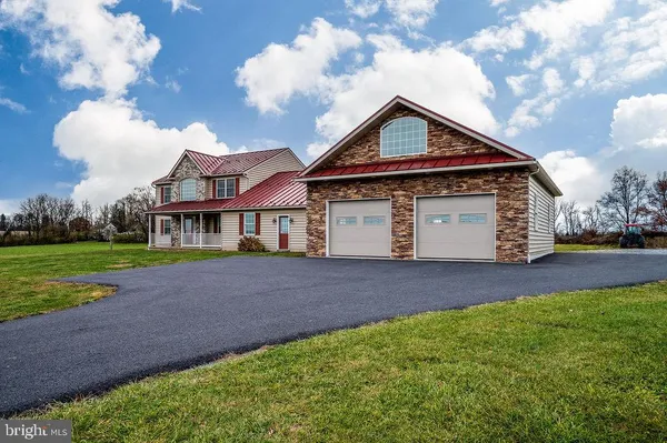 a front view of a house with a garage