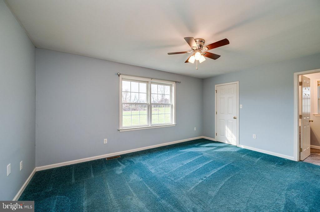 130 Troxel Road Shoemakersville, PA 19555 - Photo 35 of 100 a view of an empty room with window and a kitchen