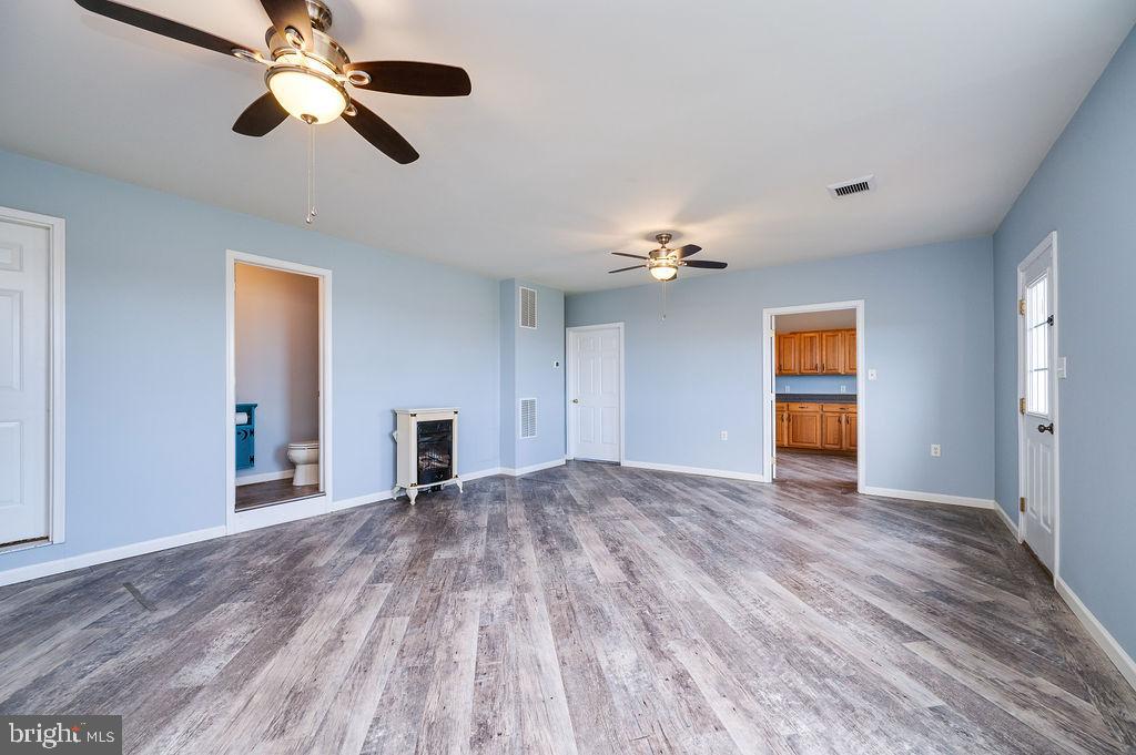 130 Troxel Road Shoemakersville, PA 19555 - Photo 43 of 100 a view of empty room with wooden floor and ceiling fan