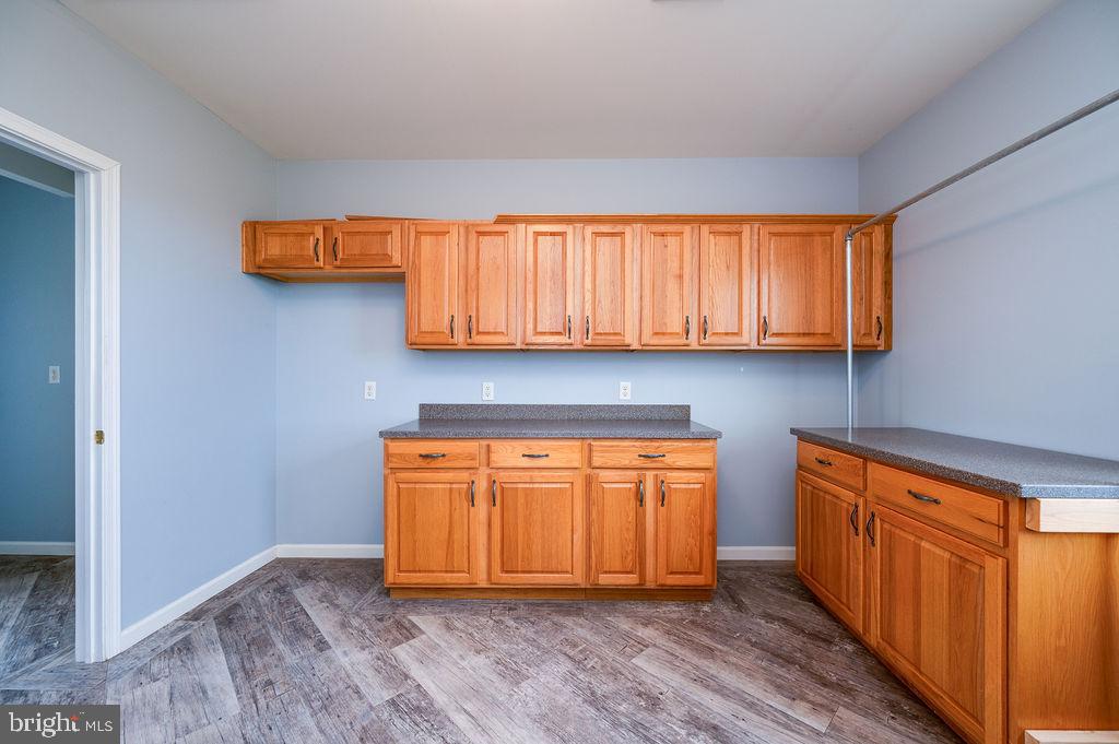 130 Troxel Road Shoemakersville, PA 19555 - Photo 48 of 100 a kitchen with stainless steel appliances granite countertop wooden cabinets and a wooden floor