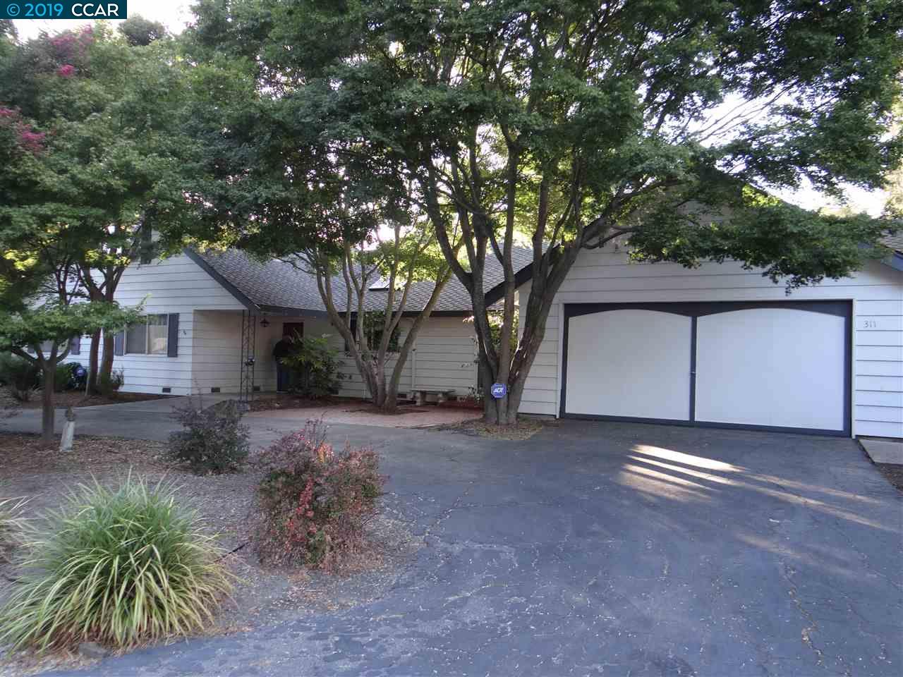 a house with a tree in the background