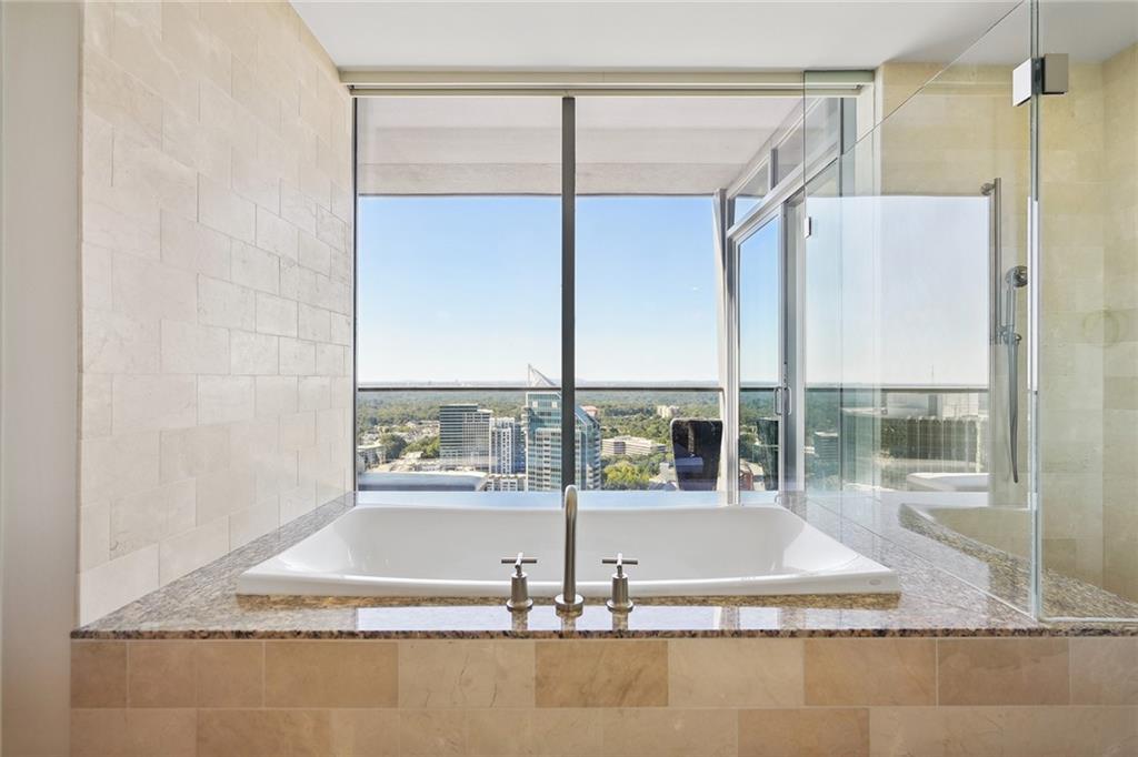 3344 Peachtree Road Northeast, Unit 3202 Atlanta, GA 30326 - Photo 29 of 39 a view of bathroom with bathtub and shower