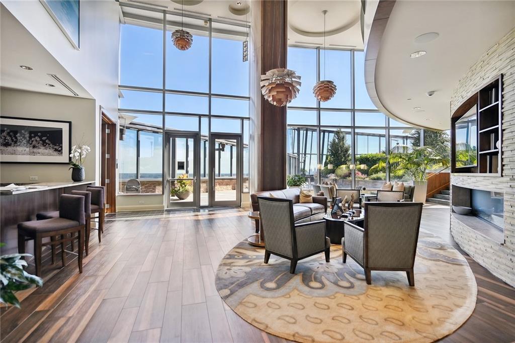3344 Peachtree Road Northeast, Unit 3202 Atlanta, GA 30326 - Photo 39 of 39 a living room filled with furniture hardwood floor and a chandelier