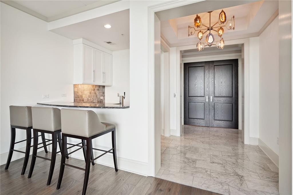 3344 Peachtree Road Northeast, Unit 3202 Atlanta, GA 30326 - Photo 10 of 39 a view of a hallway with seating area