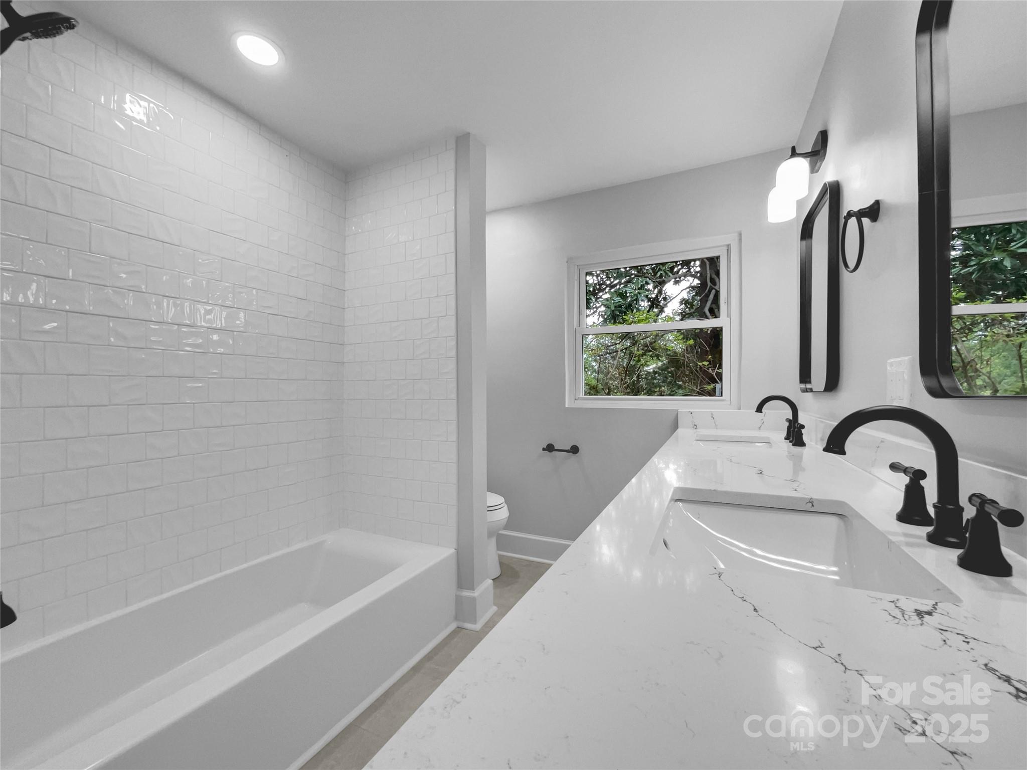 141 Edenvale Road Rock Hill, SC 29730 - Photo 14 of 27 a bathroom with a sink and a bathtub