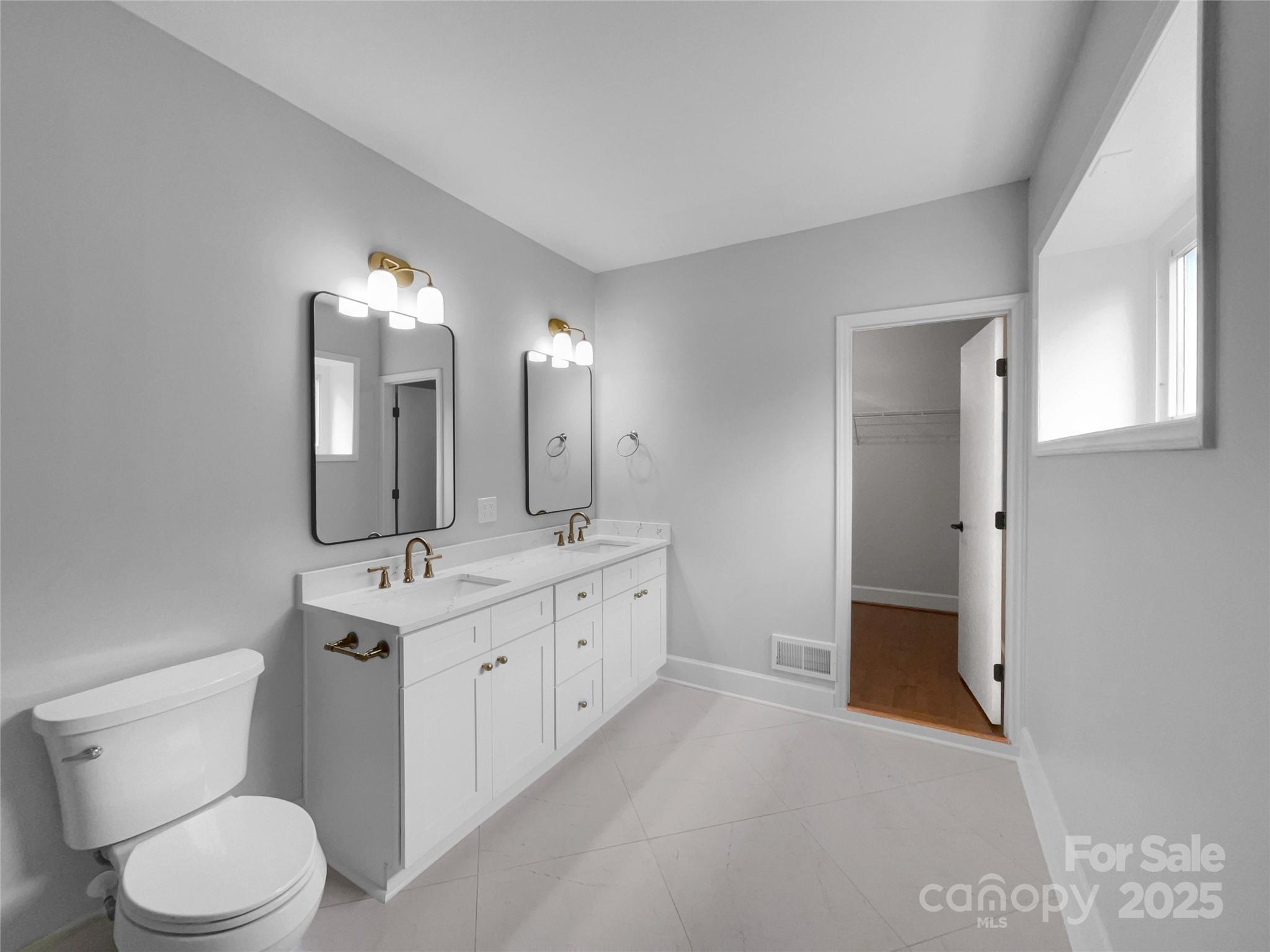 141 Edenvale Road Rock Hill, SC 29730 - Photo 15 of 27 a spacious bathroom with a double vanity sink and a mirror