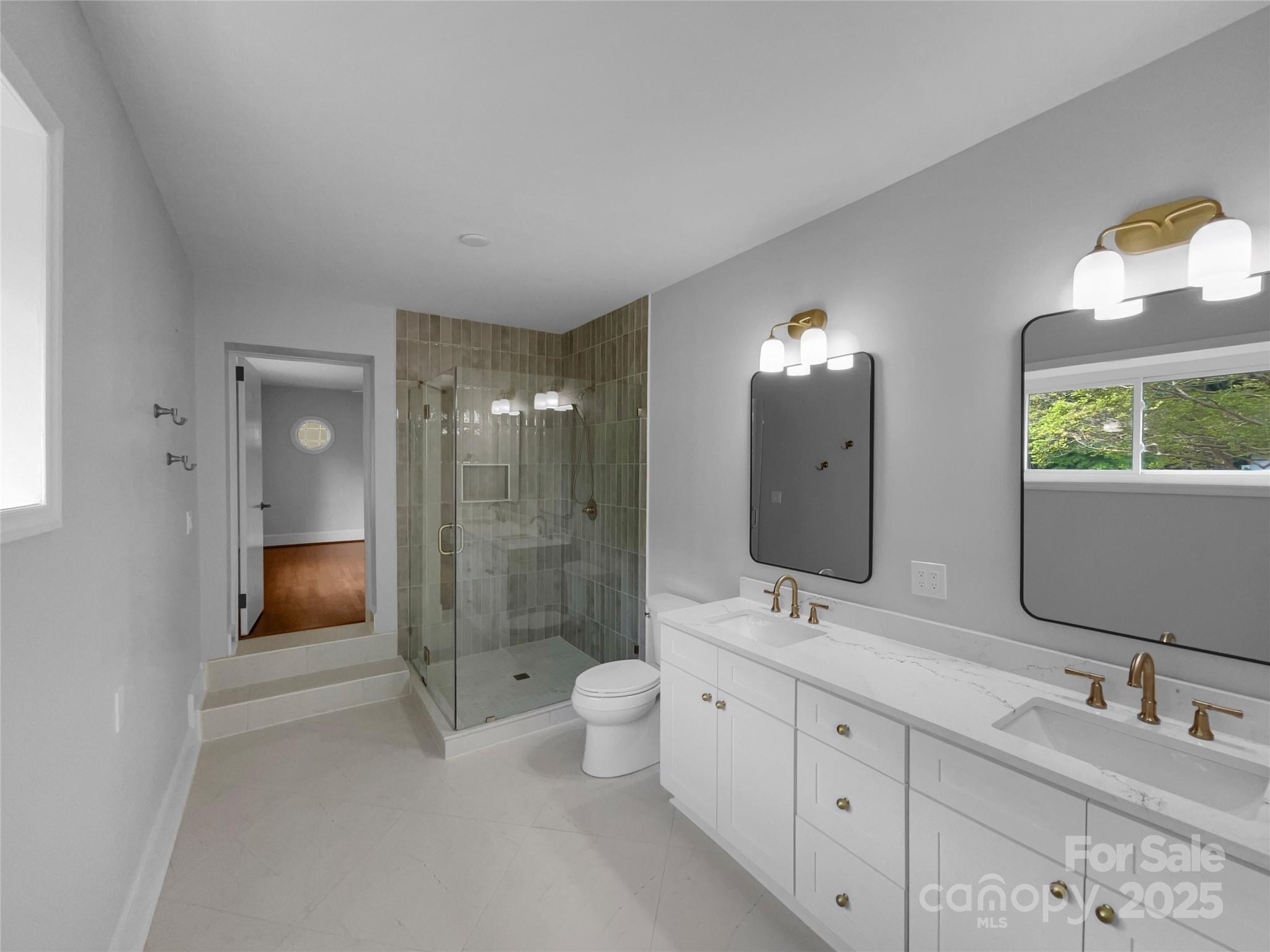 141 Edenvale Road Rock Hill, SC 29730 - Photo 18 of 27 a bathroom with a double vanity sink toilet and shower