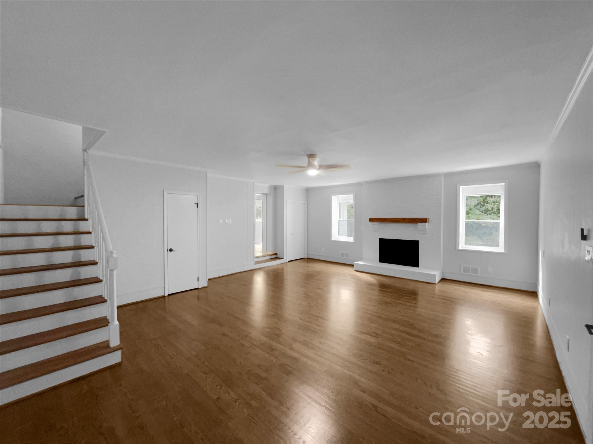 141 Edenvale Road Rock Hill, SC 29730 - Photo 20 of 27 a view of empty room with wooden floor and fireplace