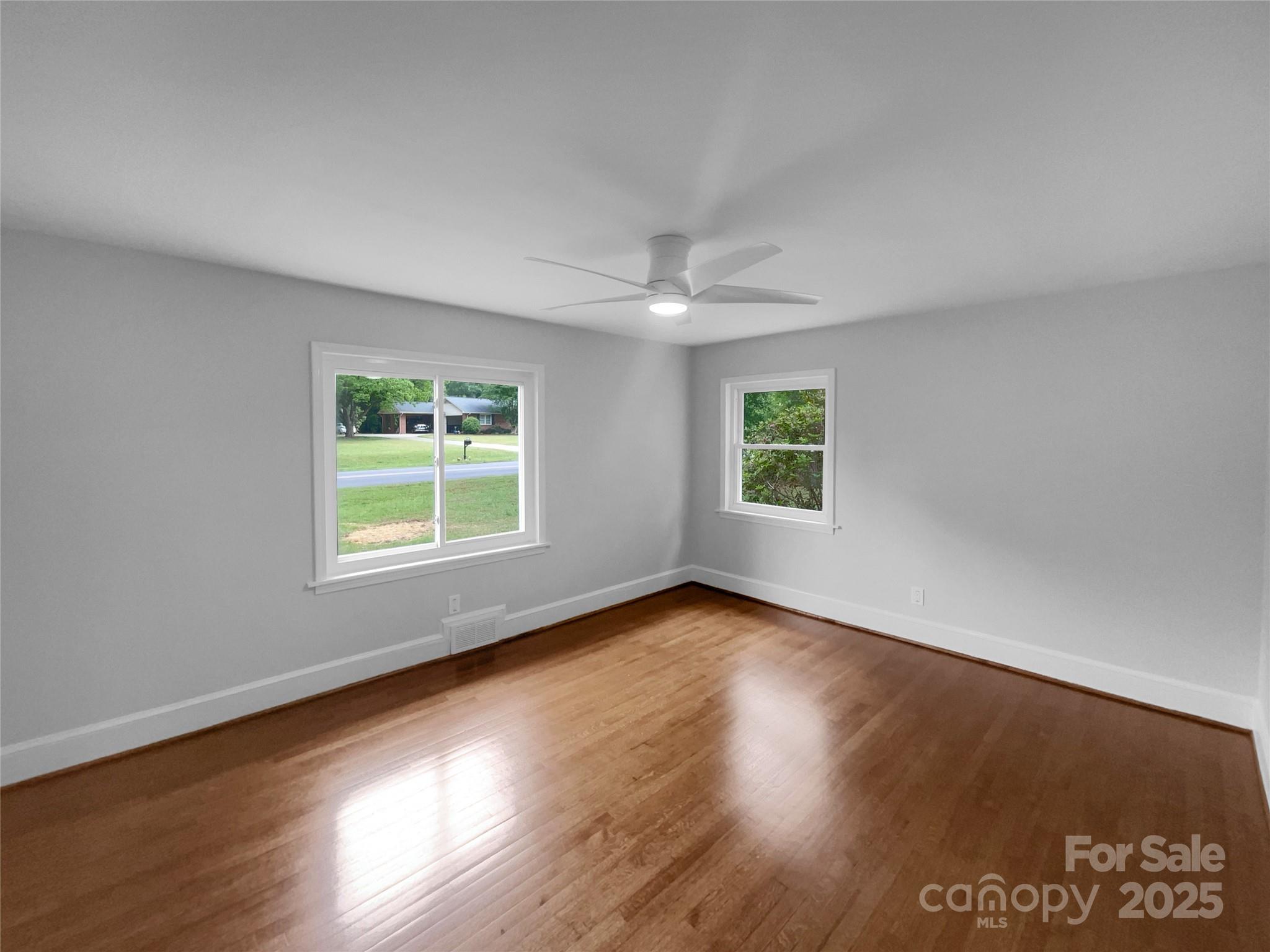 141 Edenvale Road Rock Hill, SC 29730 - Photo 5 of 27 a view of an empty room with wooden floor and a window