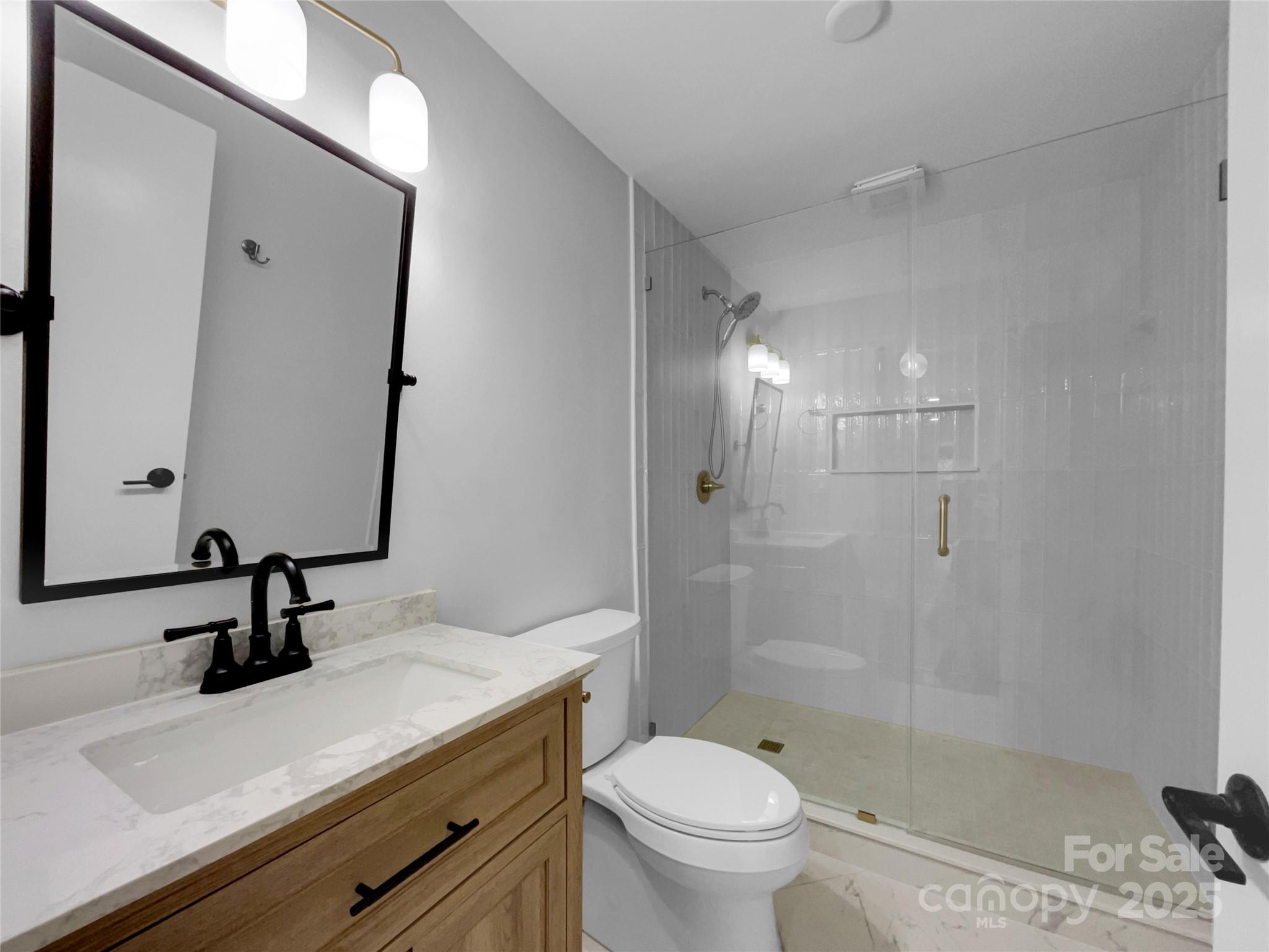 141 Edenvale Road Rock Hill, SC 29730 - Photo 7 of 27 a bathroom with a sink a toilet and shower