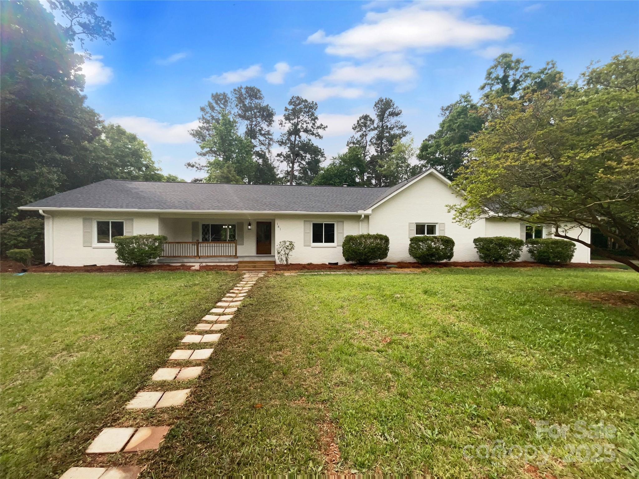 141 Edenvale Road Rock Hill, SC 29730 - Photo 9 of 27 a front view of a house with a garden