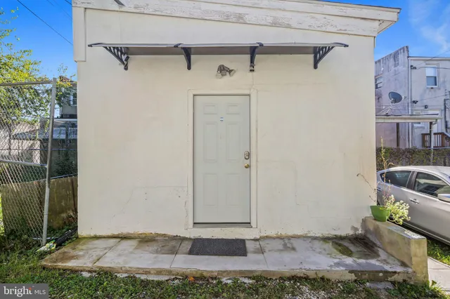 a view of a house with a small yard