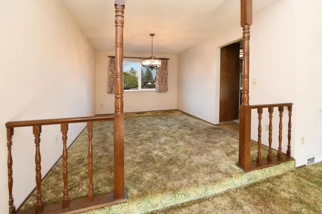 a view of kitchen with cabinets