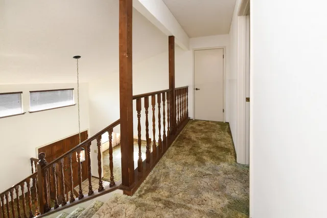 a spacious bathroom with a shower sink and mirror