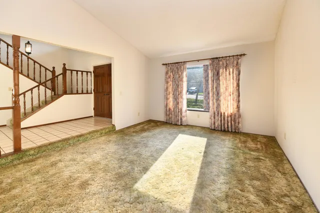 a view of a hallway with staircase