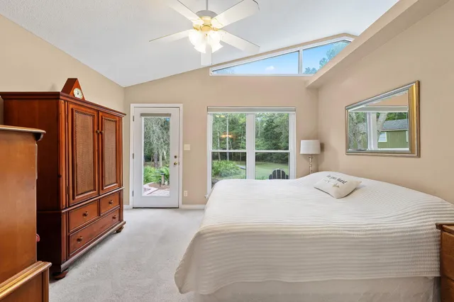 a bedroom with a bed dresser and a window