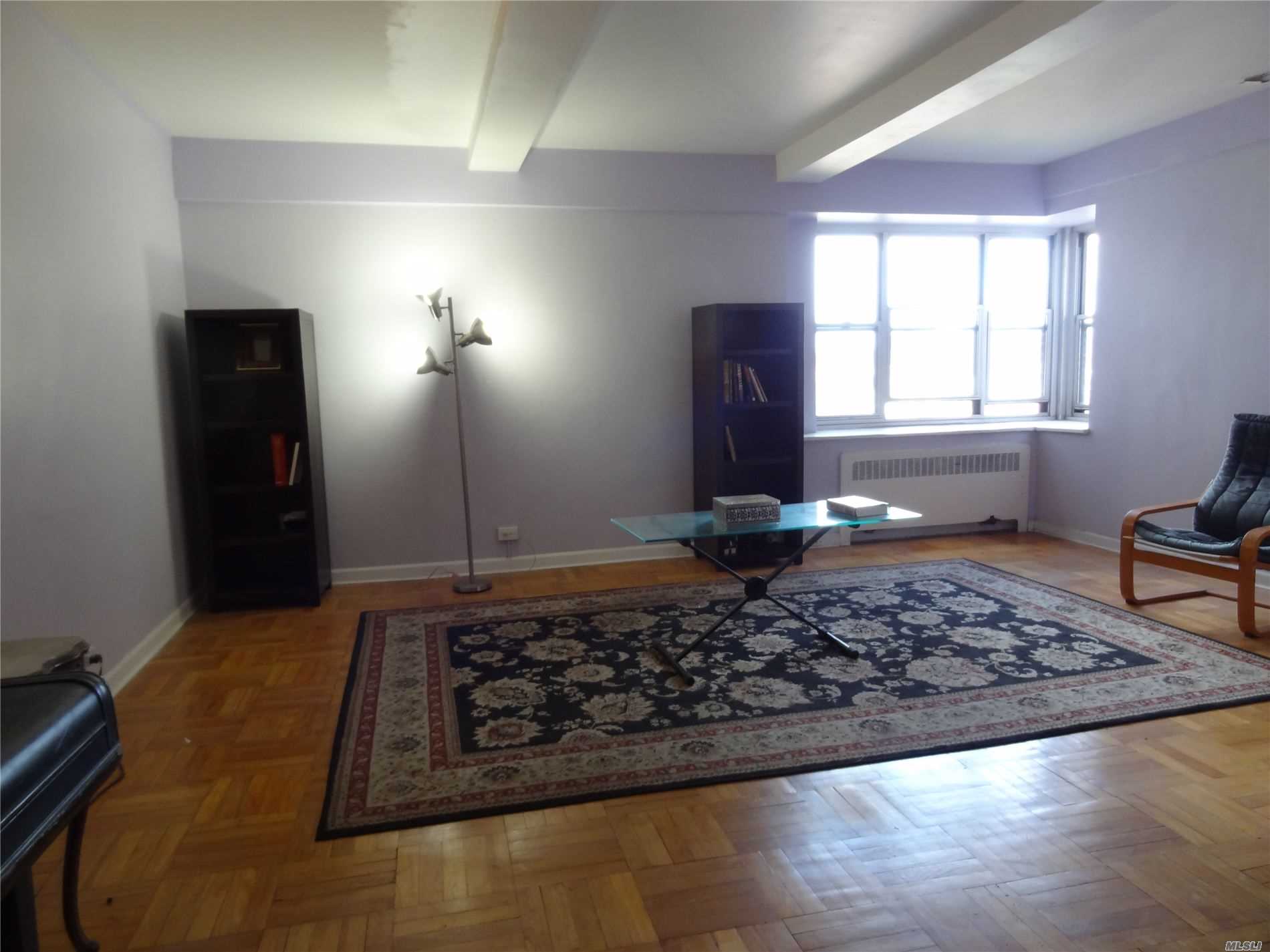 a living room with a rug