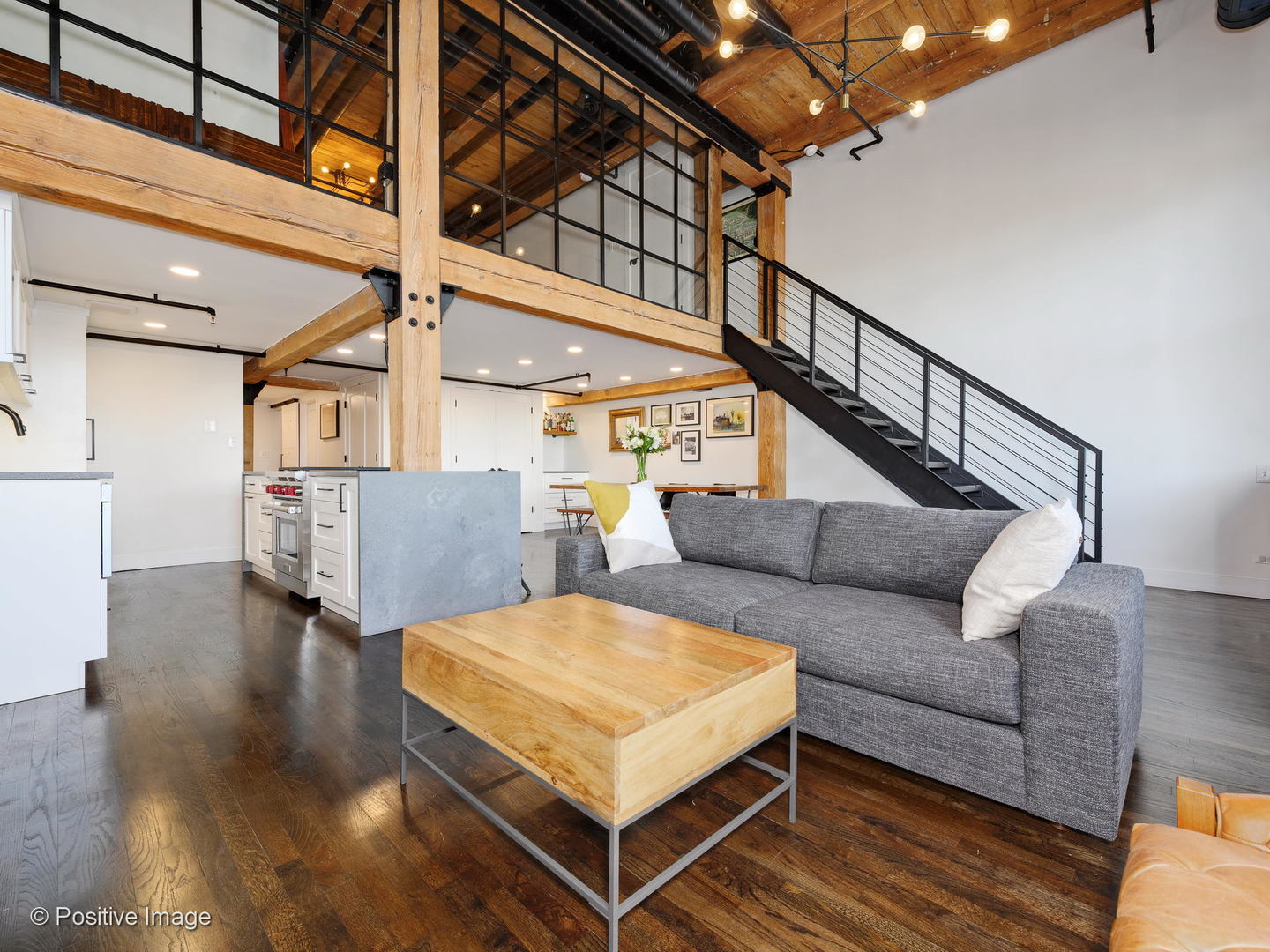 1000 West Washington Boulevard, Unit 540 Chicago, IL 60607 - Photo 2 of 28 a living room with furniture and a table