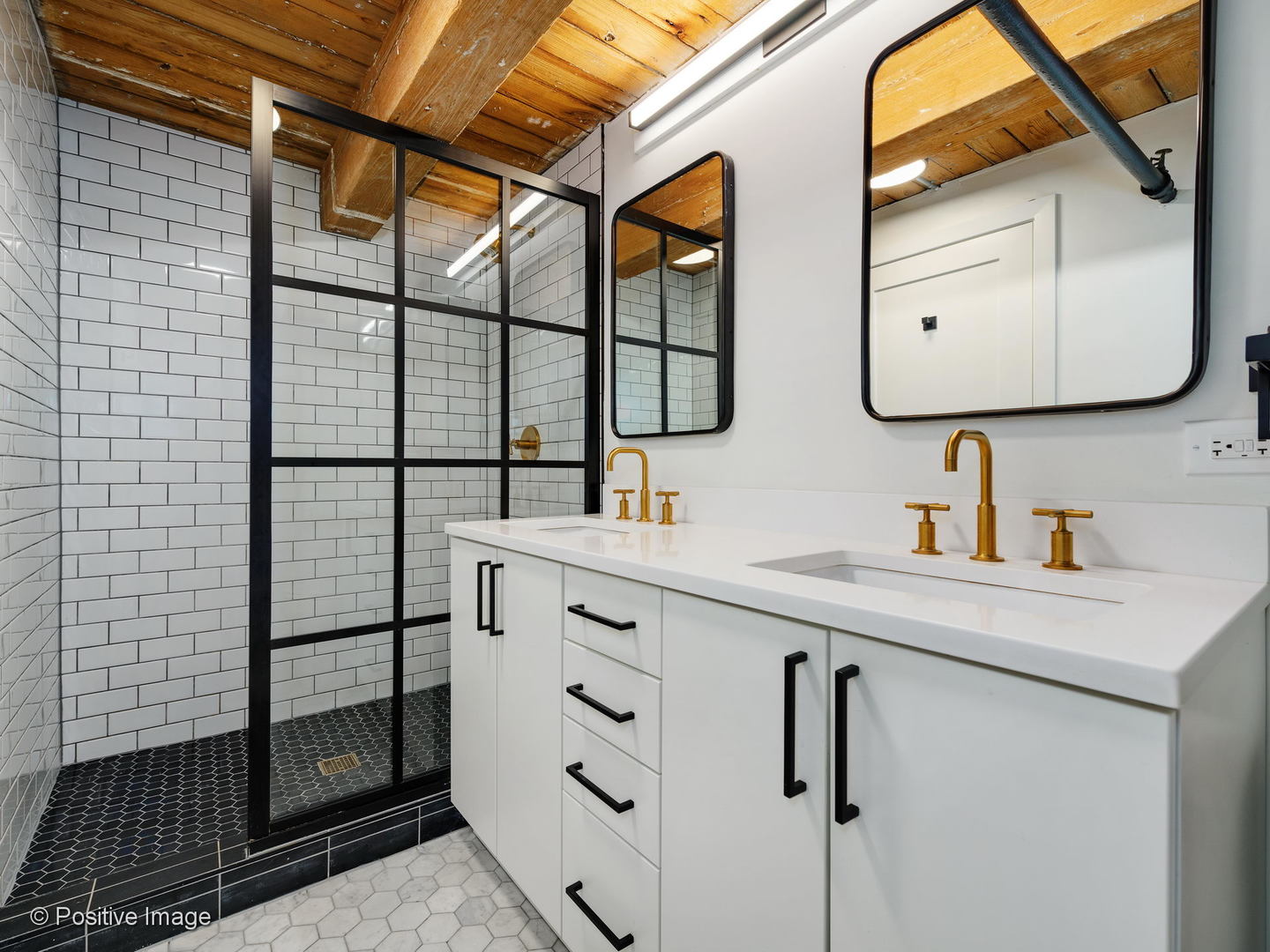 1000 West Washington Boulevard, Unit 540 Chicago, IL 60607 - Photo 18 of 28 a bathroom with a sink and a mirror