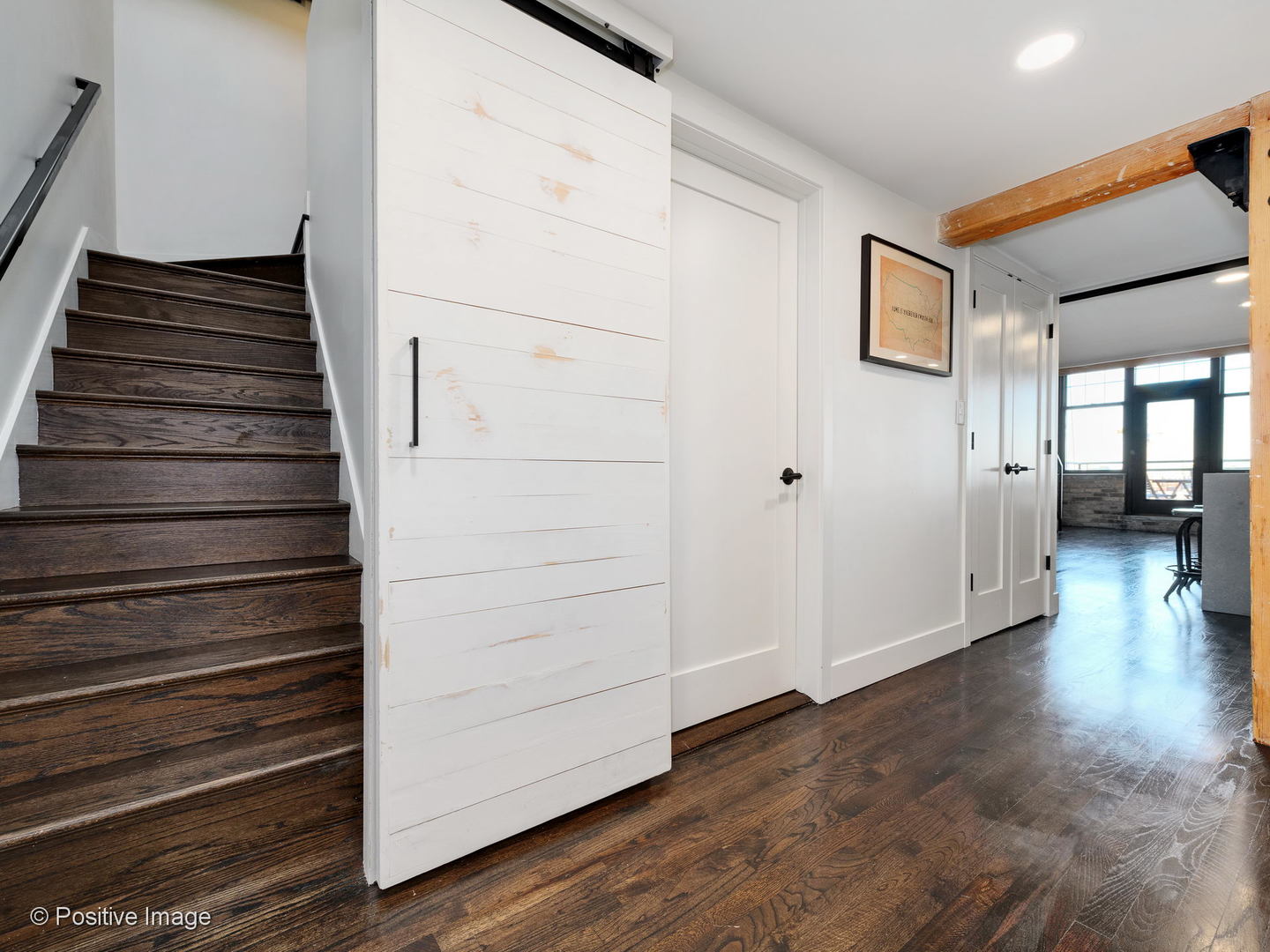 1000 West Washington Boulevard, Unit 540 Chicago, IL 60607 - Photo 21 of 28 a view of a hallway with wooden floor and entryway