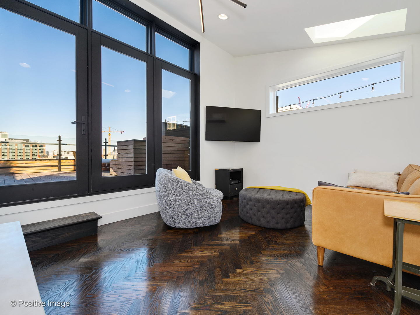 1000 West Washington Boulevard, Unit 540 Chicago, IL 60607 - Photo 23 of 28 a living room with fireplace furniture and a flat screen tv