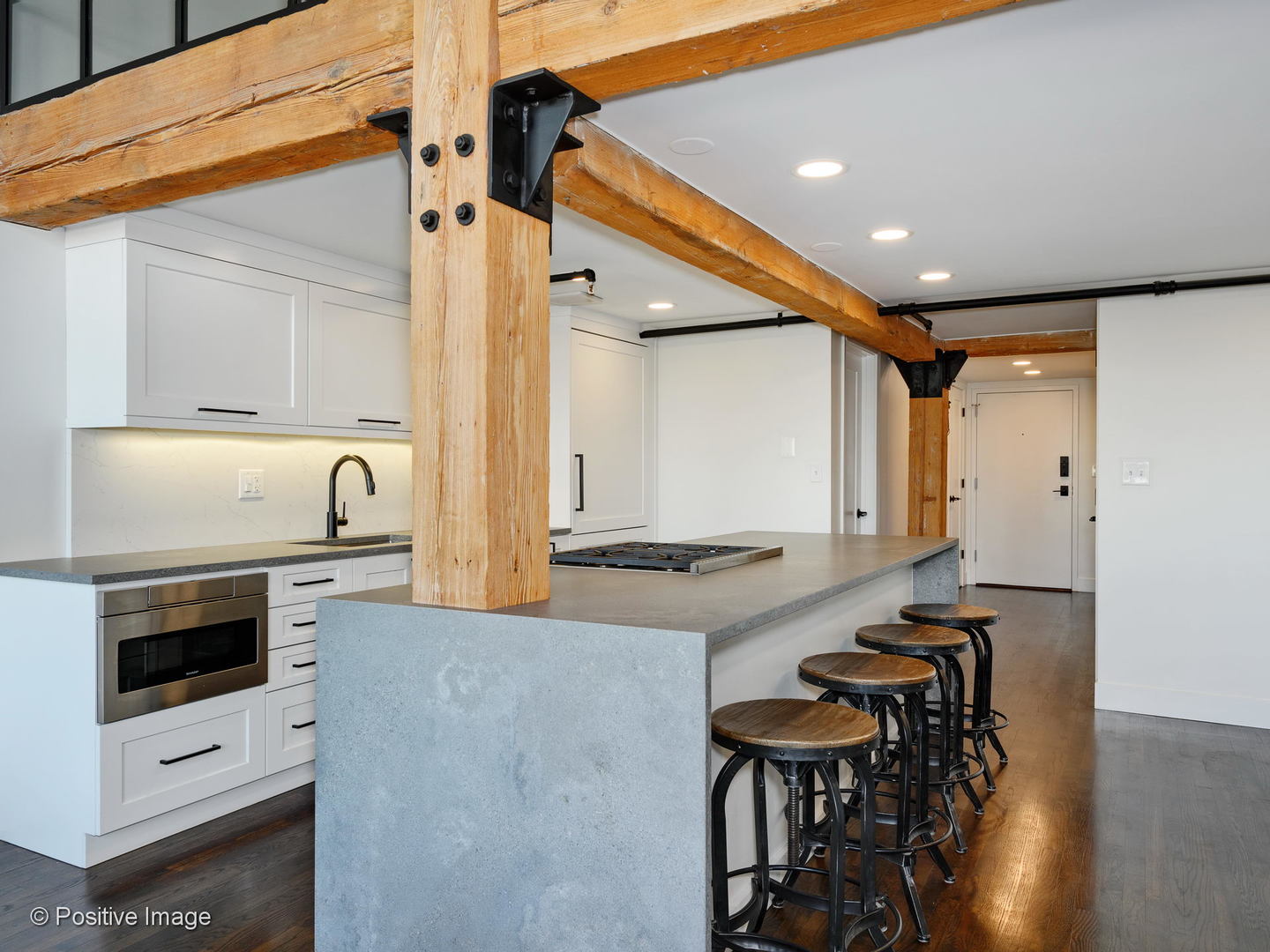 1000 West Washington Boulevard, Unit 540 Chicago, IL 60607 - Photo 9 of 28 a kitchen with a table chairs a stove and a refrigerator