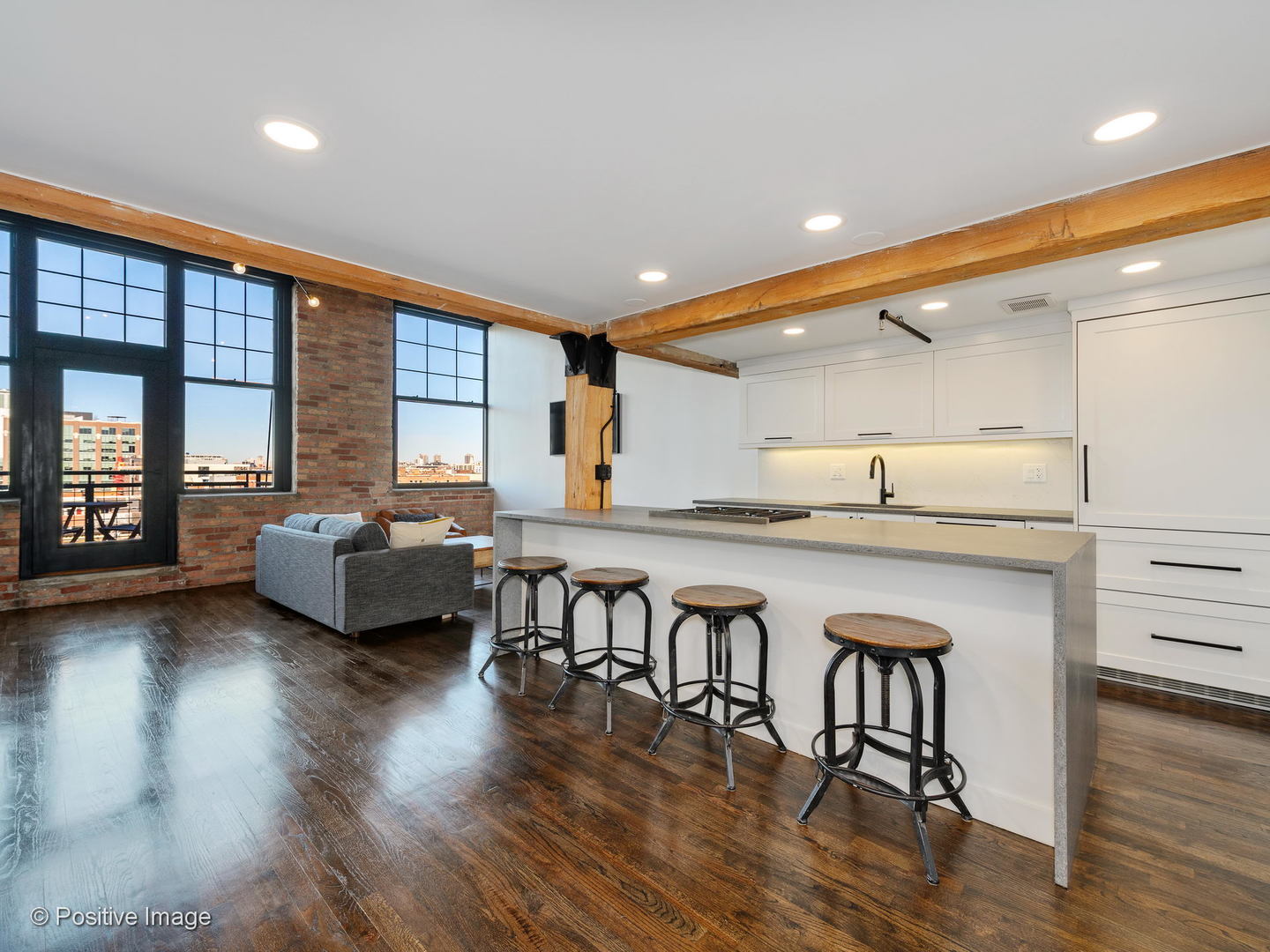 1000 West Washington Boulevard, Unit 540 Chicago, IL 60607 - Photo 10 of 28 a living room with furniture a wooden floor and a large window