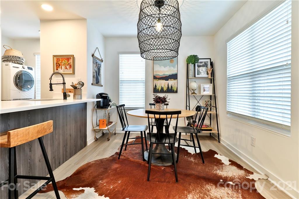 1537 Briar Creek Road, Unit A Charlotte, NC 28205 - Photo 12 of 30 a dining room with furniture and window