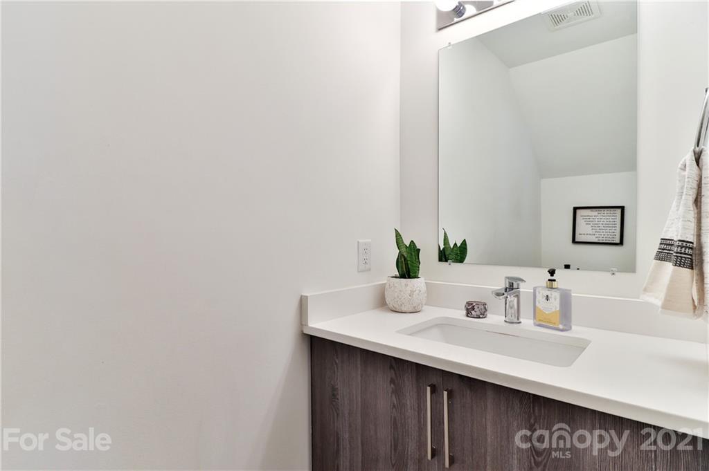 1537 Briar Creek Road, Unit A Charlotte, NC 28205 - Photo 16 of 30 a bathroom with a sink and a mirror