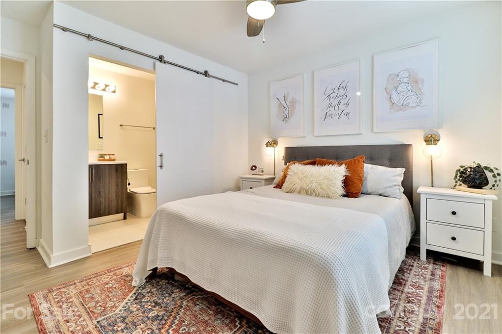 1537 Briar Creek Road, Unit A Charlotte, NC 28205 - Photo 18 of 30 a bedroom with a bed and a window in it