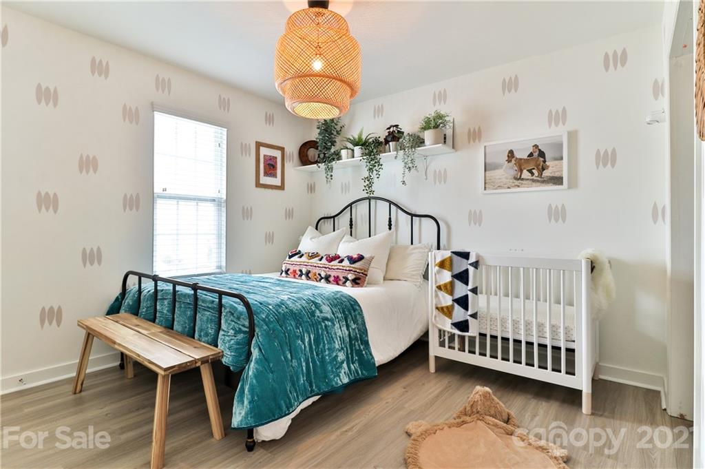 1537 Briar Creek Road, Unit A Charlotte, NC 28205 - Photo 21 of 30 a bedroom with a bed and window