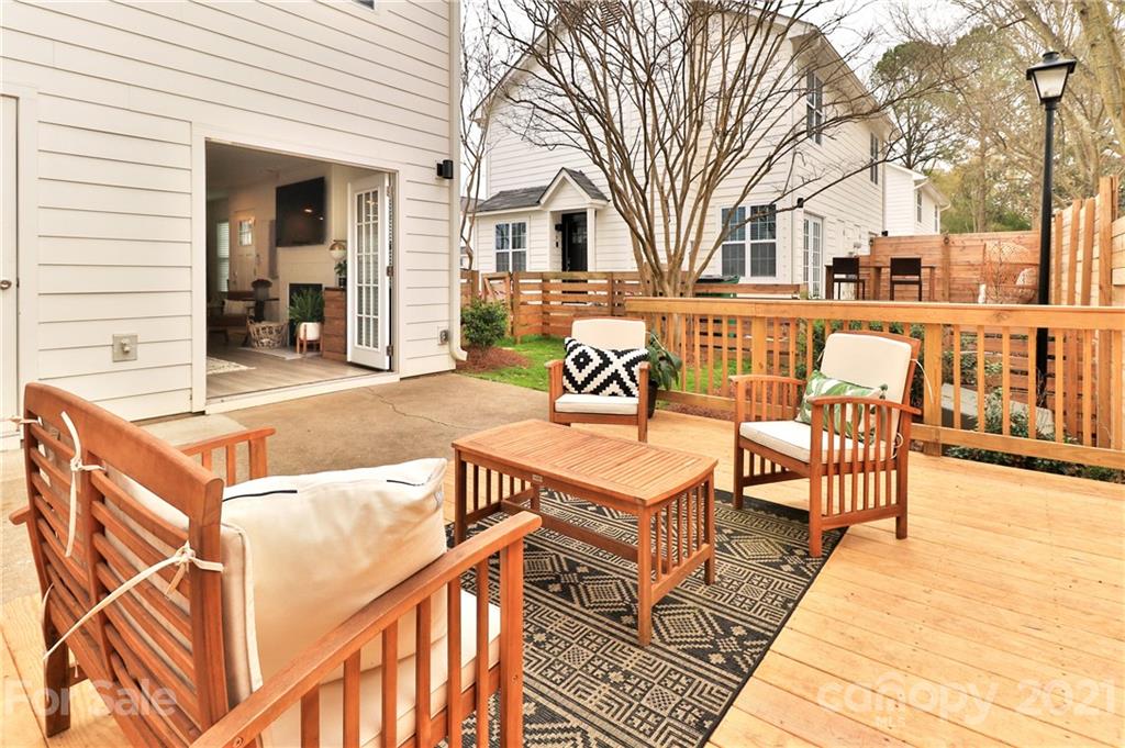 1537 Briar Creek Road, Unit A Charlotte, NC 28205 - Photo 23 of 30 a view of a house with wooden floor and furniture