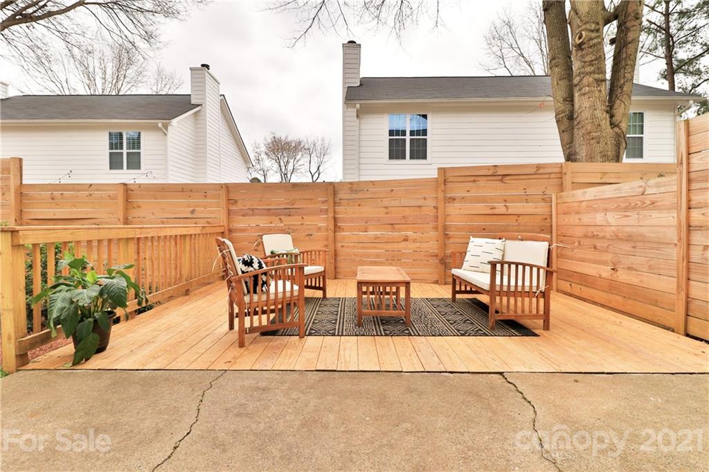 1537 Briar Creek Road, Unit A Charlotte, NC 28205 - Photo 25 of 30 a view of a patio with table and chairs and potted plants