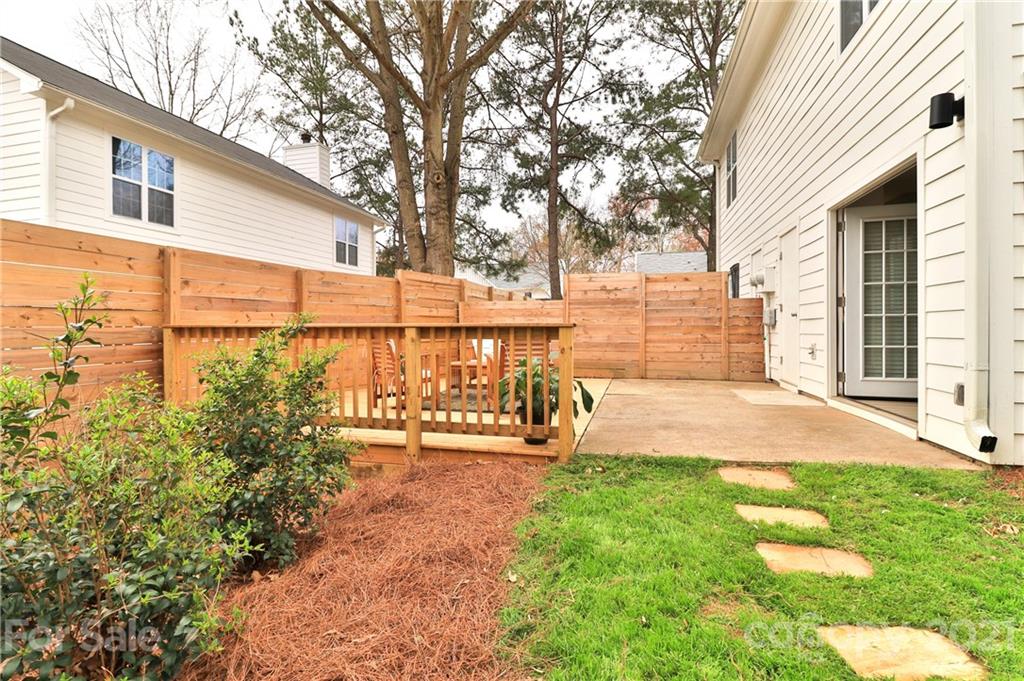 1537 Briar Creek Road, Unit A Charlotte, NC 28205 - Photo 27 of 30 a front view of a house with a yard and trees