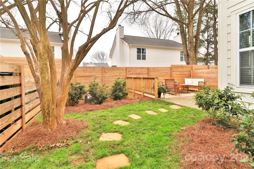 1537 Briar Creek Road, Unit A Charlotte, NC 28205 - Photo 29 of 30 a view of backyard with a garden and outdoor seating